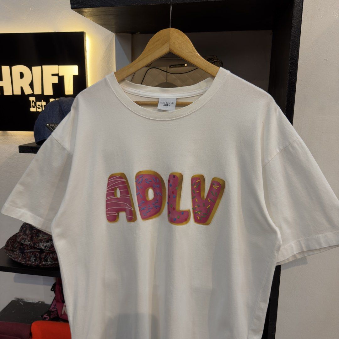 ADLV Donut Spellout White Shirt (Category: Tshirts & Polo Shirts ) located in Manila. Submitted by jerichomal82553 (Listing ID 1468908341, Image 2). Description: ADLV Donut Spellout White Shirt 23 by 29 Good Condition Complete Tags.