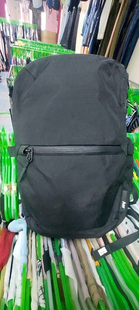 Aer X-Pac Day Pack 3 Black Backpack (Category: Backpacks) located in Puerto Princesa. Submitted by YeSurJOMS (Listing ID 1468851976, Image 1). Description: - Model: Aer Day Pack 3 (X-Pac Edition) - Color: Black with vibrant orange interior lining - Material: Weather-resistant, durable X-Pac fabric - Hardware: Secure and sleek Fidlock buckle hardware - Storage: Convenient vertical front zip pocket - Comfort: Padded mesh shoulder straps for all-day