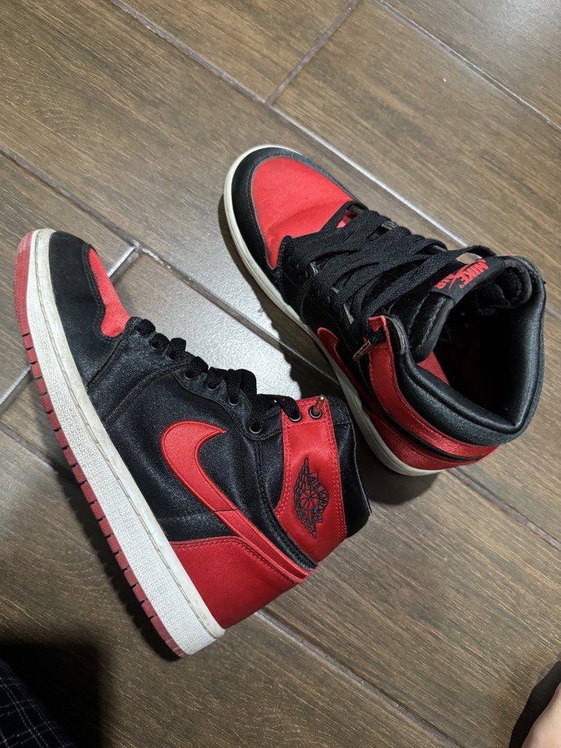 Air Jordan 1 Retro High OG "Satin Bred” (Category: Sneakers) located in San Miguel. Submitted by rhaiper38277 (Listing ID 1468748127, Image 2). Description: Price is negotiable Bought directly from the Nike website for almost ₱10,000. RFS: Barely used, so it has just been sitting around collecting dust. Condition: Just dusty, no hidden defects. Comes with the shoes only (no original box)..