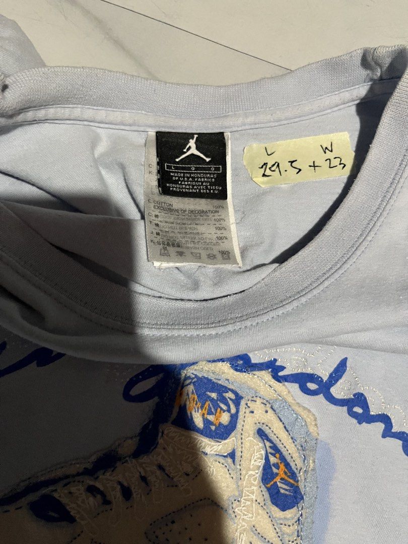Air Jordan Blue Graphic Tee Size L (Category: Tshirts & Polo Shirts ) located in Cavite. Submitted by christianzuuu (Listing ID 1468786347, Image 3). Description: - Brand: Air Jordan - Color: Light blue - Size: Large (Made in Honduras) - Material: 100% cotton - Design: Front shoe graphic with cursive text and small orange Jumpman logo on upper back - Measurements: Length 29.5" | Width 23" - Condition: Good / Ready to ship - Feel free to send a me