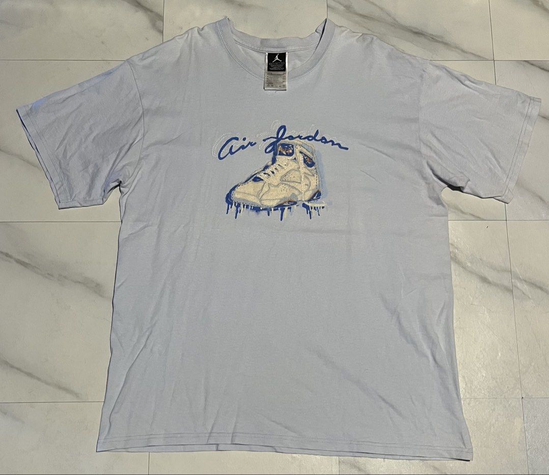 Air Jordan Blue Graphic Tee Size L (Category: Tshirts & Polo Shirts ) located in Cavite. Submitted by christianzuuu (Listing ID 1468786347, Image 1). Description: - Brand: Air Jordan - Color: Light blue - Size: Large (Made in Honduras) - Material: 100% cotton - Design: Front shoe graphic with cursive text and small orange Jumpman logo on upper back - Measurements: Length 29.5" | Width 23" - Condition: Good / Ready to ship - Feel free to send a me