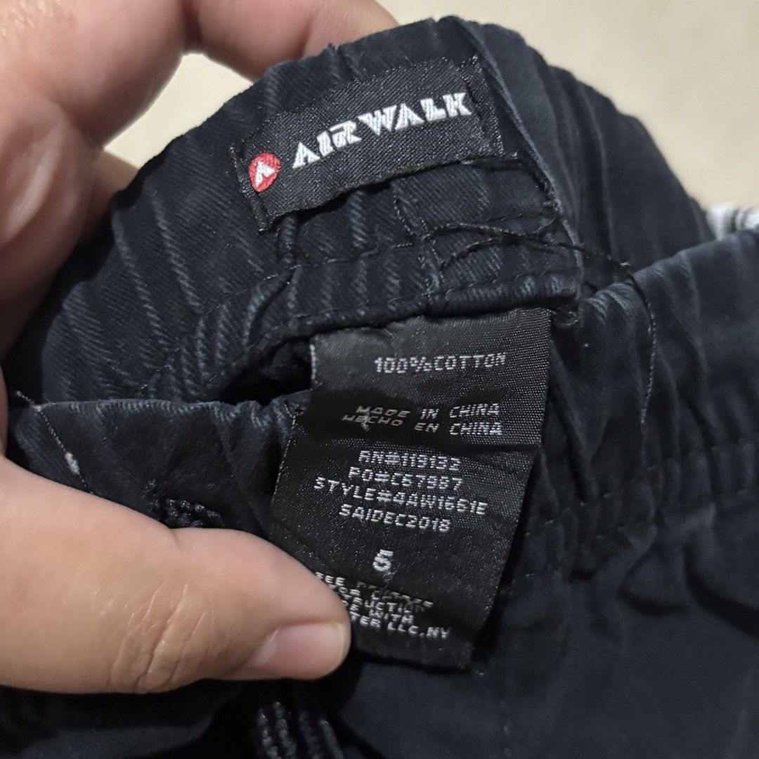 Airwalk Boys Black Shorts Size 5 (Category: Shorts) located in Taguig. Submitted by sunnyplaythingsph (Listing ID 1468880277, Image 2). Description: - Brand: Airwalk - Size: 5 - Material: 100% Cotton for all-day comfort - Waistband: Elastic with adjustable drawstring - Design: Cool white side stripes on one leg - Pockets: 2 front pockets and 2 back pockets - Condition: Great for casual lakad, chilling, or everyday wear.