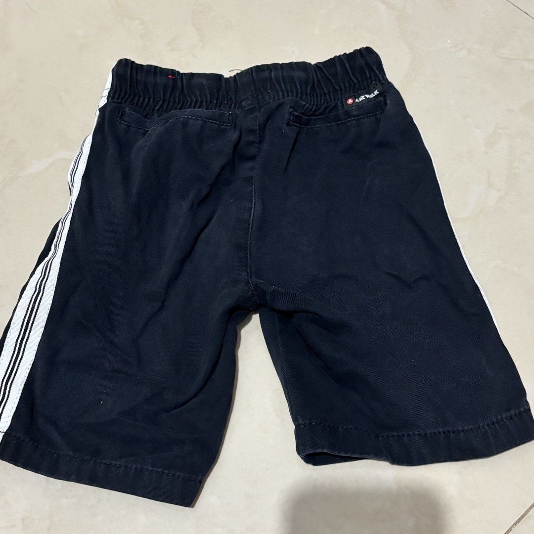 Airwalk Boys Black Shorts Size 5 (Category: Shorts) located in Taguig. Submitted by sunnyplaythingsph (Listing ID 1468880277, Image 3). Description: - Brand: Airwalk - Size: 5 - Material: 100% Cotton for all-day comfort - Waistband: Elastic with adjustable drawstring - Design: Cool white side stripes on one leg - Pockets: 2 front pockets and 2 back pockets - Condition: Great for casual lakad, chilling, or everyday wear.