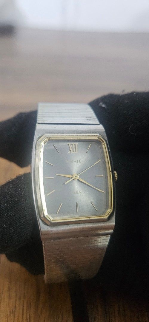 Alba Quartz Watch Two-Tone Rectangle Dial Vintage (Category: Women's Watches) located in Santa Maria. Submitted by rommelmateo (Listing ID 1468859613, Image 1). Description: - Brand: Alba - Style: Classic vintage timepiece, ideal for daily wear - Case: Two-tone silver and gold stainless steel with a unique top-mounted crown - Dial: Rectangular grey sunburst with Roman numeral XII at the 9 o'clock position - Details: Elegant gold-tone hands and ho