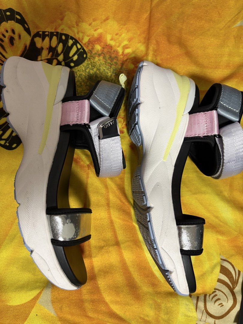 ALDO Platform Sandals Multi-Color Chunky Sole (Category: Sandals) located in Manila. Submitted by nykji96 (Listing ID 1468719948, Image 2). Description: - Brand: ALDO - Style: Platform sandals with chunky soles - Colors: Multi-color straps (silver metallic, pink, and grey webbing) with a black footbed - Closure: Adjustable hook-and-loop ankle straps - Condition: Flaking and wear present on the silver metallic front strap; soles have minor wear wi