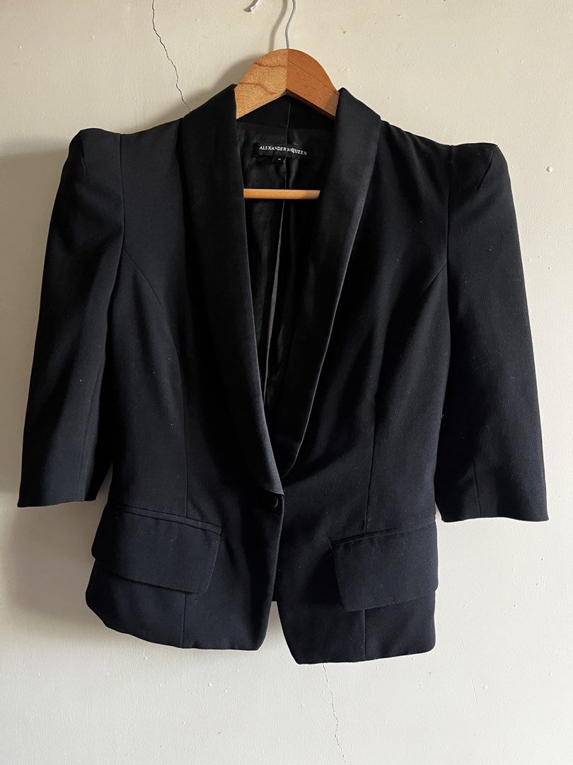 Alexander McQueen Black Blazer Jacket (Category: Coats, Jackets and Outerwear) located in Bulacan. Submitted by handmedownfinds (Listing ID 1468717929, Image 1). Description: - Brand: Alexander McQueen - Size: 6 (Philippine fit guide available upon request) - Color: Classic Black - Material: 100% Cotton - Design: Structured fit, shawl lapel, padded shoulders, and front pocket flaps - Sleeves: Three-quarter length - Closure: Single button front - 