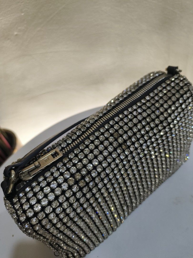 Alexander Wang Rhinestone Shoulder Bag (Category: Luxury Bags & Wallets) located in General Santos City (Dadiangas). Submitted by happyrabbit_42489c (Listing ID 1468781694, Image 2). Description: - Fully covered in sparkling rhinestones for a glamorous look - Black strap featuring the distinct Alexander Wang logo print - Secure top zipper closure with sleek silver hardware - Compact size designed to hold your night-out essentials - Impeccably cle
