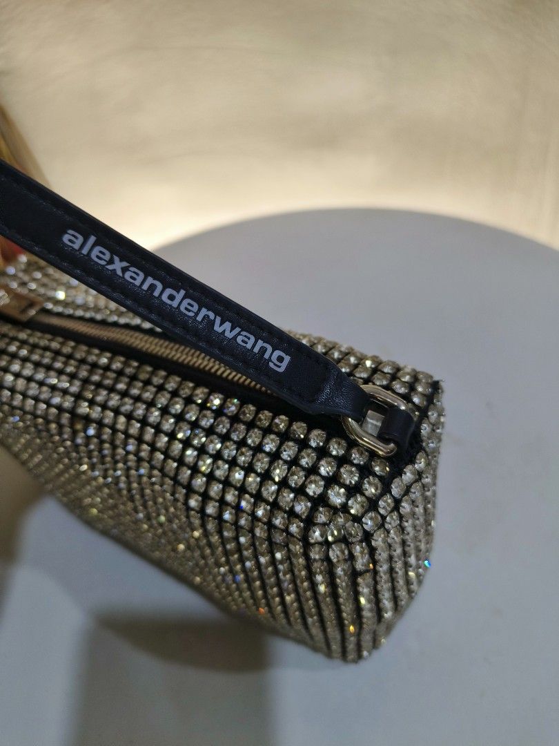 Alexander Wang Rhinestone Shoulder Bag (Category: Luxury Bags & Wallets) located in General Santos City (Dadiangas). Submitted by happyrabbit_42489c (Listing ID 1468781694, Image 3). Description: - Fully covered in sparkling rhinestones for a glamorous look - Black strap featuring the distinct Alexander Wang logo print - Secure top zipper closure with sleek silver hardware - Compact size designed to hold your night-out essentials - Impeccably cle