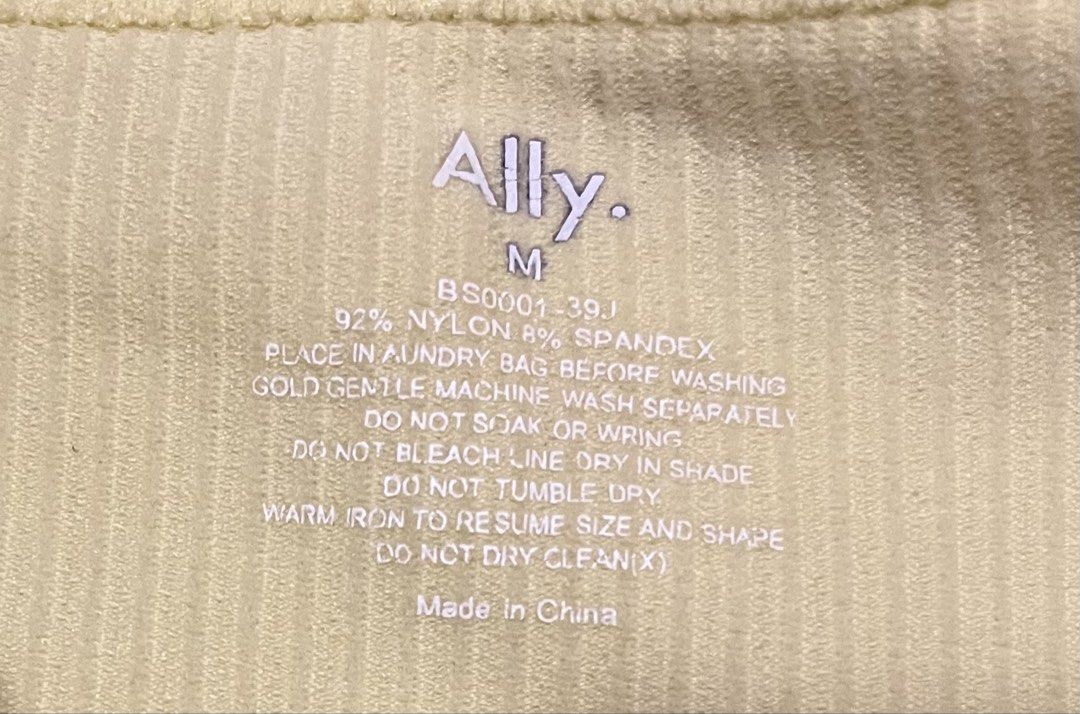 Ally Ribbed Tank Top Yellow Size M (Category: Sleeveless) located in Koronadal. Submitted by keenpenguin_6af0c6 (Listing ID 1468815615, Image 2). Description: - Brand: Ally - Style: Ribbed tank top with crew neckline and sleeveless cut - Color: Pastel Yellow - Size: Medium - Material: 92% nylon, 8% spandex (seamless stretch fabric) - Features: Tagless interior print with care instructions - Condition: Brand new / Excellent - Best for: Comfortable
