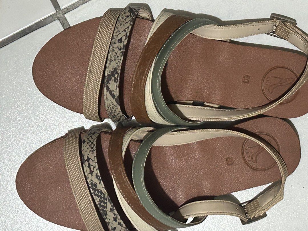 Alts PH Becky Multi-strap casual sandals (Category: Flats & Sandals) located in Davao. Submitted by the23rd_preloved (Listing ID 1468881778, Image 2). Description: - Brand: Alts PH - Model: Becky in Neutral - Style: Multi-strap flat sandals - Colors & Patterns: Brown, tan, green, beige, and snake print - Details: Back ankle strap with buckle closure, comfortable brown footbed with embossed logo stamp - Size: 6 - Condition: Like new, rarely used -