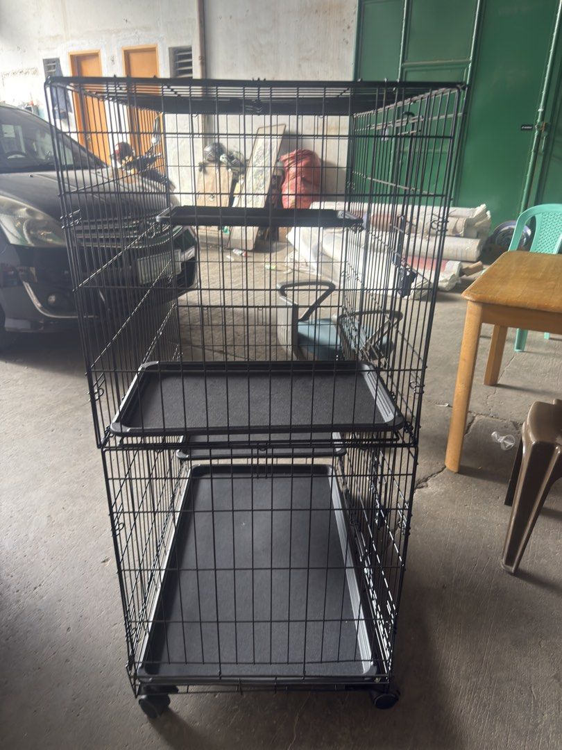 Amazon Basics Large 3-Tier Cat Cage Playpen (Category: Homes & Other Pet Accessories) located in Binan City. Submitted by celestescloset (Listing ID 1468812059, Image 2). Description: - Brand: Amazon Basics Large 3-Tier Cat Cage / Playpen - Material/Color: Sturdy black wire construction - Dimensions: 35.8" x 22.4" x 50.6" - Features: Rolling wheels for easy mobility & foldable design for storage - Convenience: Removable plastic trays for hassle-f