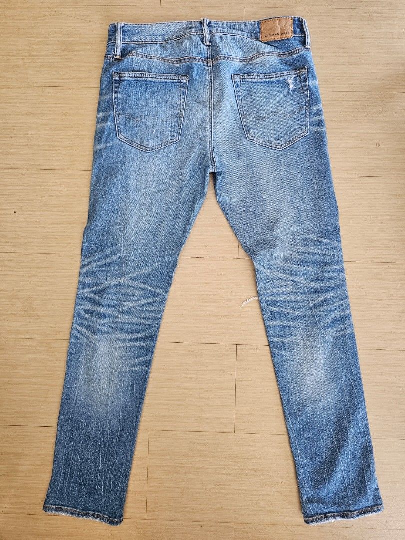 American Eagle AirFlex+ Distressed Denim Jeans (Category: Jeans) located in Cagayan de Oro. Submitted by brucewee (Listing ID 1468793587, Image 2). Description: - Brand: American Eagle - Style: AirFlex+ distressed blue jeans - Details: Ripped details on both legs, whiskering, classic 5-pocket design - Closure: Standard button and zip fly.