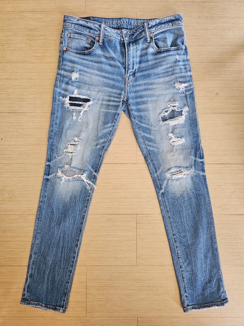 American Eagle AirFlex+ Distressed Denim Jeans (Category: Jeans) located in Cagayan de Oro. Submitted by brucewee (Listing ID 1468793587, Image 1). Description: - Brand: American Eagle - Style: AirFlex+ distressed blue jeans - Details: Ripped details on both legs, whiskering, classic 5-pocket design - Closure: Standard button and zip fly.