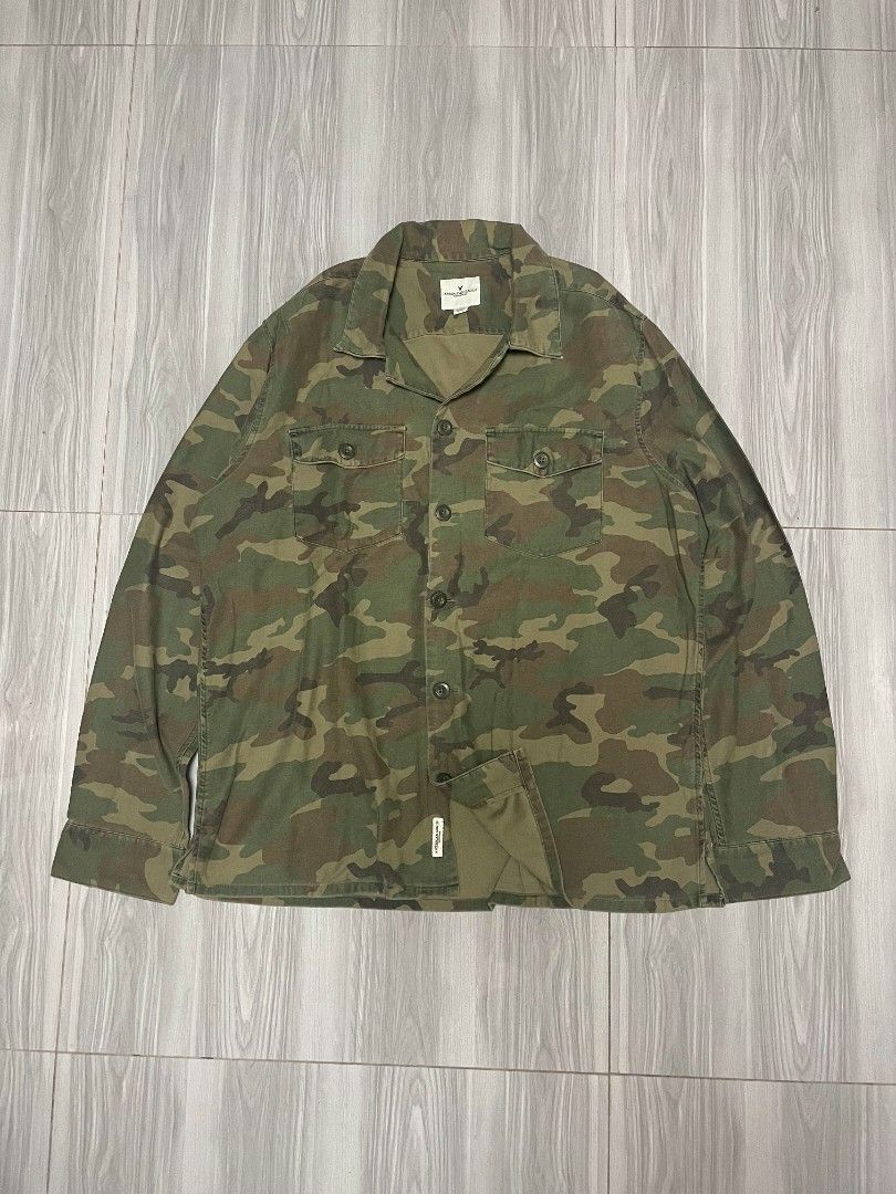 American Eagle longsleeve polo camo (Category: Coats, Jackets and Outerwear) located in Lipa City. Submitted by t1pce3garmentz (Listing ID 1468729719, Image 1). Description: - Brand: American Eagle Outfitters - Size: XL (TG/EXG) - Print: Classic green and brown camouflage - Features: Button-down front, structured collar, two front chest pockets, and button cuffs - Material: Heavy-duty fabric construction - Condition: Clean interior with original 