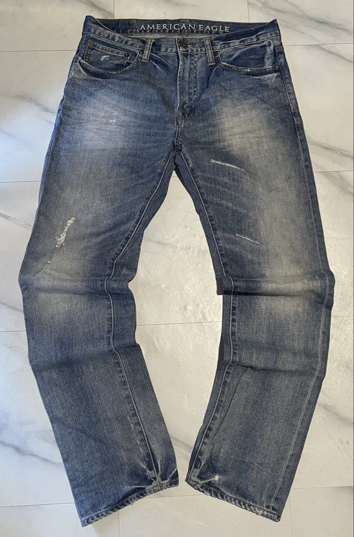 American Eagle Original Taper Jeans (Category: Jeans) located in Cavite. Submitted by christianzuuu (Listing ID 1468766855, Image 1). Description: - Brand: American Eagle - Fit: Original taper cut - Wash: Classic medium blue with factory distressing and whiskering - Closure: Button fly - Material: Sturdy, everyday-wear cotton - Measurements (laid flat): - Waist: 17 inches - Length: 42 inches - Leg opening: 11.5 inches - Condition: Excellent, read