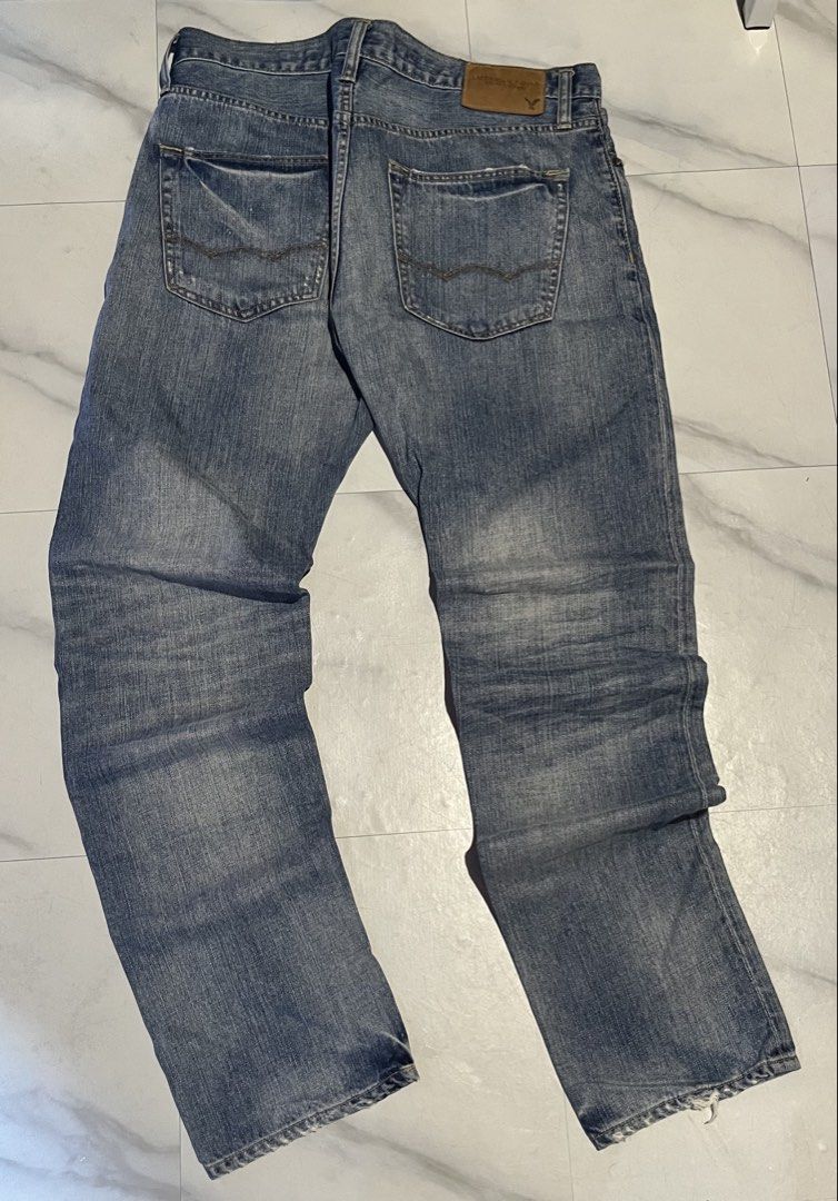 American Eagle Original Taper Jeans (Category: Jeans) located in Cavite. Submitted by christianzuuu (Listing ID 1468766855, Image 2). Description: - Brand: American Eagle - Fit: Original taper cut - Wash: Classic medium blue with factory distressing and whiskering - Closure: Button fly - Material: Sturdy, everyday-wear cotton - Measurements (laid flat): - Waist: 17 inches - Length: 42 inches - Leg opening: 11.5 inches - Condition: Excellent, read
