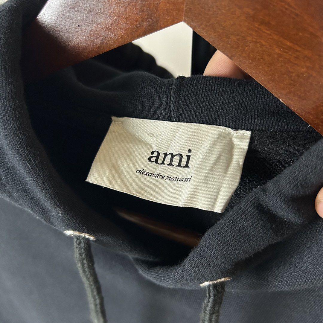 AMI Paris Hoodie (Category: Coats, Jackets and Outerwear) located in Bacolod City. Submitted by dashloots (Listing ID 1468897871, Image 3). Description: AMI Paris Hoodie Black colorway Small on tag W-21.5’ , L-26.5’ Flaws: none Mode of delivery: (J&T) 📦 Price: 1,500 Negotiable for sure buyers! Location: Bacolod City, Negros Occ.📍.