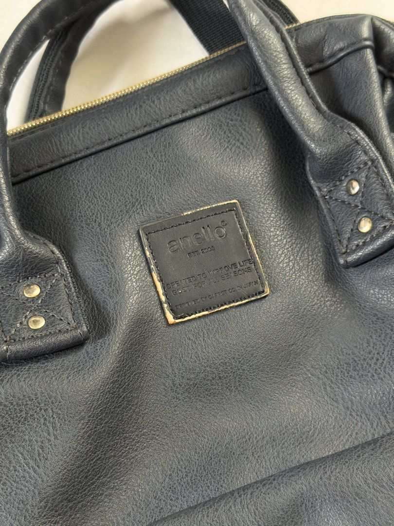 Anello Leather-Style Navy Blue Backpack (Category: Backpacks) located in Pasig City. Submitted by xojem (Listing ID 1468819298, Image 2). Description: Slight wear on the front brand patch, otherwise fully functional.