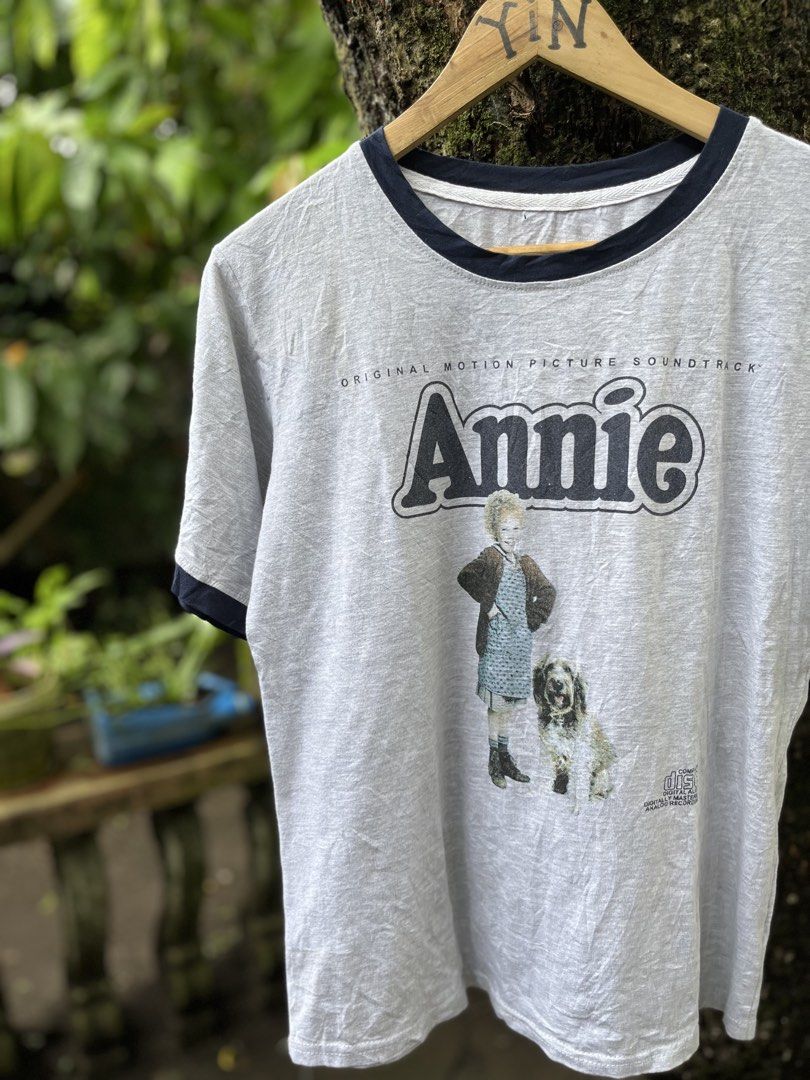 ANNIE MUSICAL MOVIE RINGER TEE (Category: Tshirts & Polo Shirts ) located in Legazpi City. Submitted by shop.grail.ph (Listing ID 1468713524, Image 1). Description: 80s musical movie annie in a nice ringer style shirt Bootleg Missing tag 1 pinhole Fits medium adult LENGTH 25 to 26 Width 19 .
