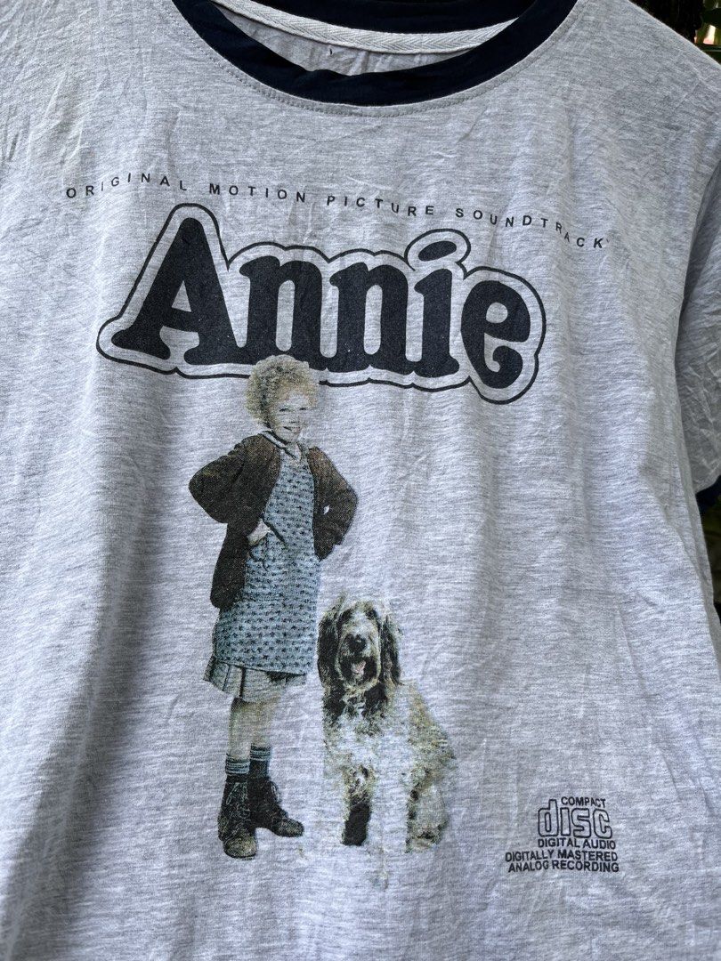 ANNIE MUSICAL MOVIE RINGER TEE (Category: Tshirts & Polo Shirts ) located in Legazpi City. Submitted by shop.grail.ph (Listing ID 1468713524, Image 3). Description: 80s musical movie annie in a nice ringer style shirt Bootleg Missing tag 1 pinhole Fits medium adult LENGTH 25 to 26 Width 19 .
