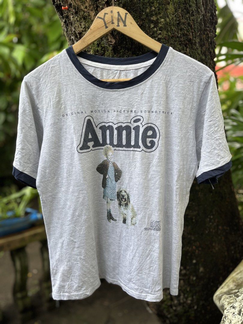 ANNIE MUSICAL MOVIE RINGER TEE (Category: Tshirts & Polo Shirts ) located in Legazpi City. Submitted by shop.grail.ph (Listing ID 1468713524, Image 2). Description: 80s musical movie annie in a nice ringer style shirt Bootleg Missing tag 1 pinhole Fits medium adult LENGTH 25 to 26 Width 19 .