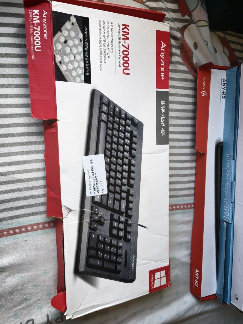 Anyzone KM-7000U 104Key USB Membrane Keyboard (Category: Computer Keyboard) located in Manila. Submitted by juvy.alpha (Listing ID 1468929076, Image 2). Description: - Model: Anyzone KM-7000U 104-key USB membrane keyboard - Color: Classic black body - Layout: Features Korean character layouts alongside standard English keys - Connection: Reliable wired USB connection - Inclusion: Comes with its original box - Condition: Standard desktop accessory