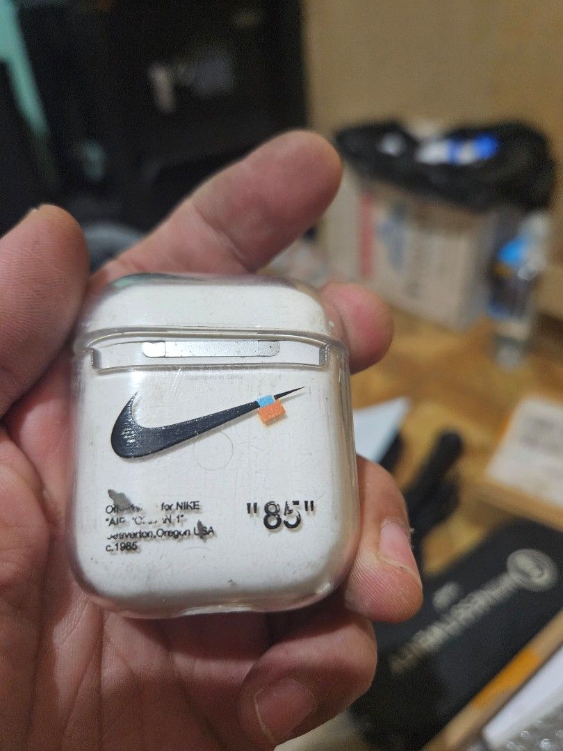 Apple AirPods with charging case and Nike case (Category: Earphones) located in Quezon City. Submitted by kizuke (Listing ID 1468904025, Image 3). Description: - Authentic Apple AirPods with charging case - Fully tested and working great - Includes a clear protective case with custom Nike graphic - Normal scuffs and wear from daily pocket carry - Battery still holds a decent charge - Thoroughly cleaned and sanitized - Ready for the next owner - g