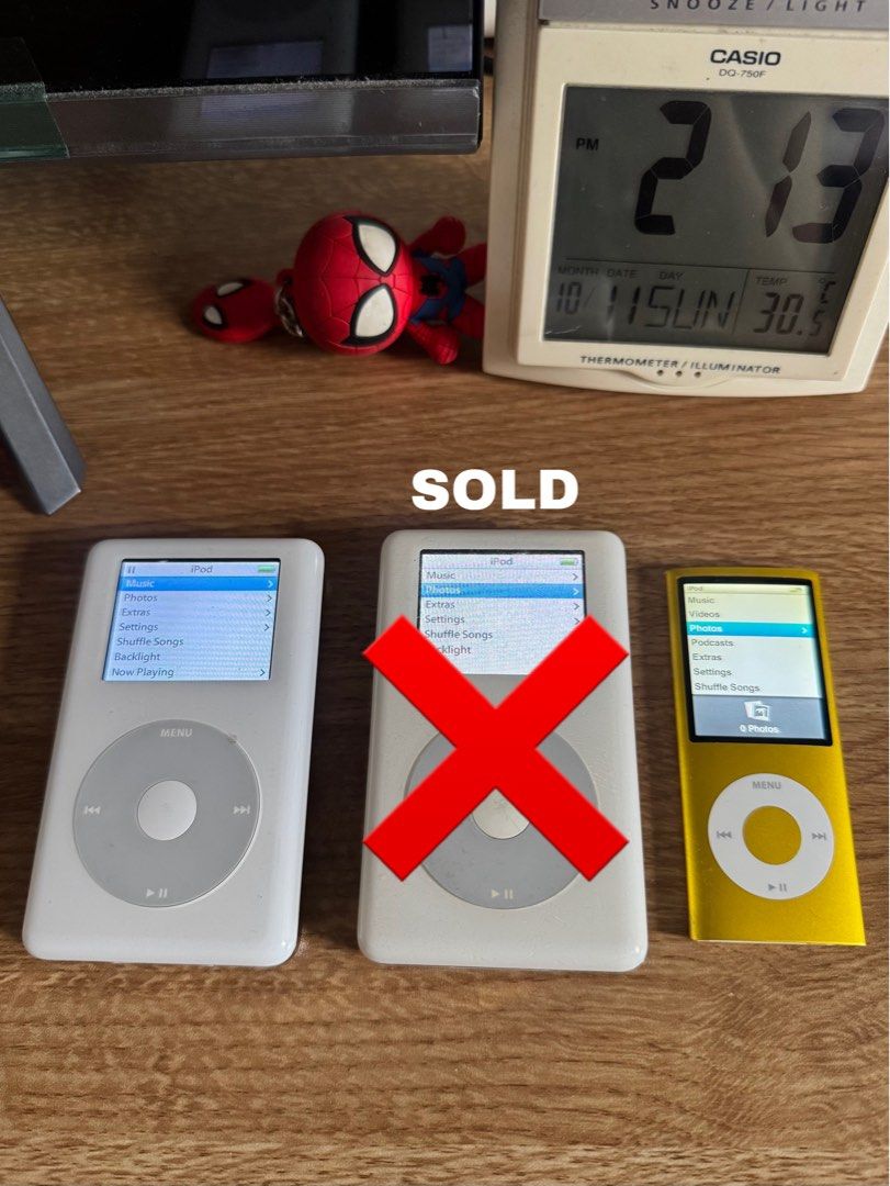 Apple iPod Classic and Nano (Category: Portable Music Players) located in Davao. Submitted by amiri.awatif (Listing ID 1467227252, Image 2). Description: three Apple iPods including two classic white models and one yellow nano. Capacities include 20GB and 60GB for the classics(SOLD), and 8GB for the nano. Click wheels fully responsive. Screens display menus clearly without dead pixels. Syncs via Windows format. Battery holds charge. 6k take all! 