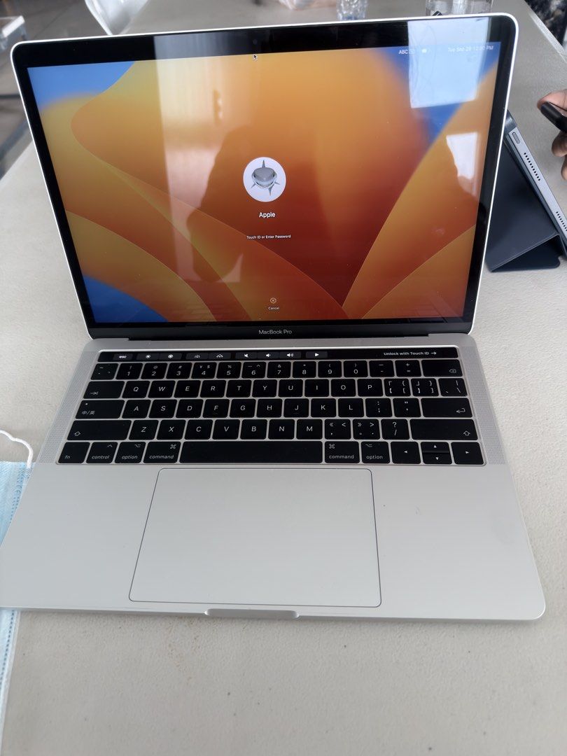 Apple MacBook Pro 2017 with Touch Bar (Category: Laptops & Notebooks) located in Quezon City. Submitted by aubjcs (Listing ID 1468752791, Image 2). Description: 8+256GB No box With Charger - Model: Silver MacBook Pro with iconic Apple logo on aluminum lid - Condition: Clean body overall with minimal wear - Display: Bright and clear screen with login screen ready for setup - Usability: Fully functional standard keyboard layout and large trackpad -
