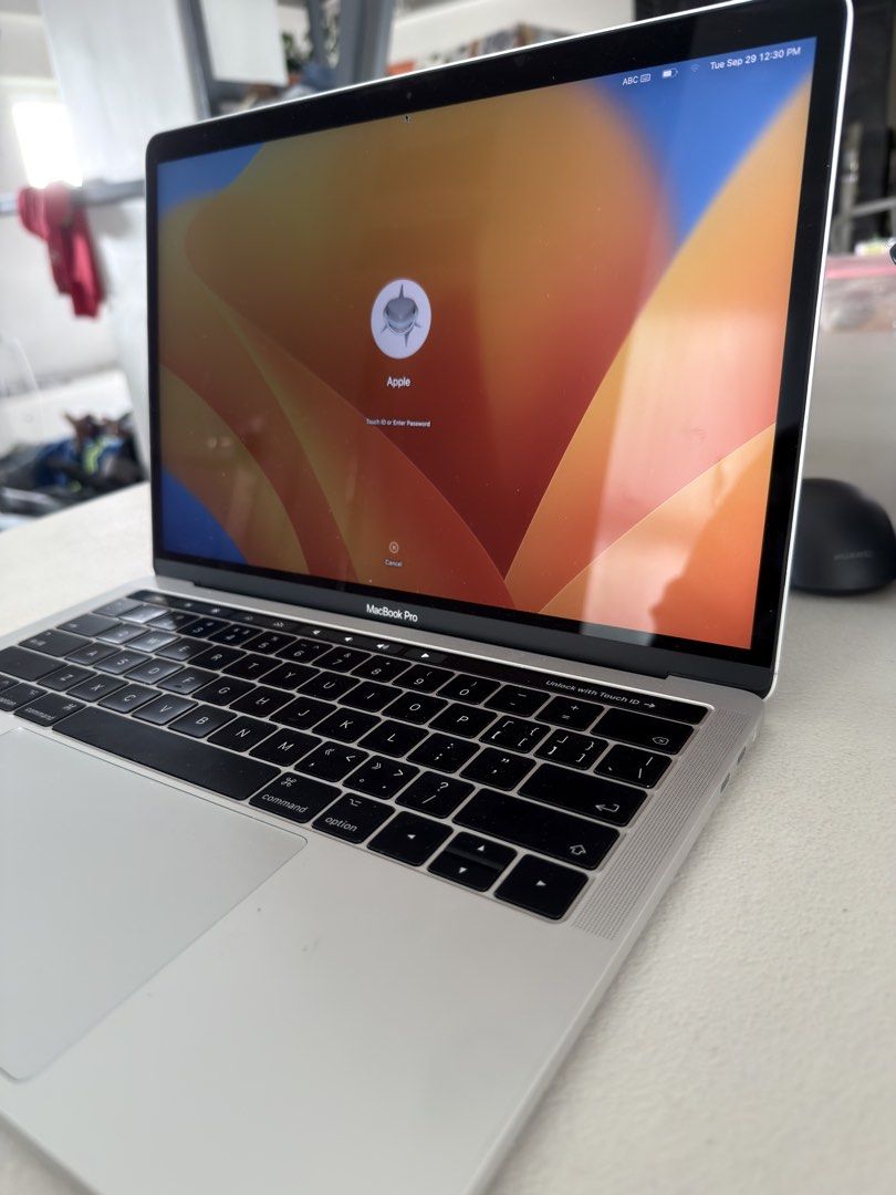 Apple MacBook Pro 2017 with Touch Bar (Category: Laptops & Notebooks) located in Quezon City. Submitted by aubjcs (Listing ID 1468752791, Image 1). Description: 8+256GB No box With Charger - Model: Silver MacBook Pro with iconic Apple logo on aluminum lid - Condition: Clean body overall with minimal wear - Display: Bright and clear screen with login screen ready for setup - Usability: Fully functional standard keyboard layout and large trackpad -