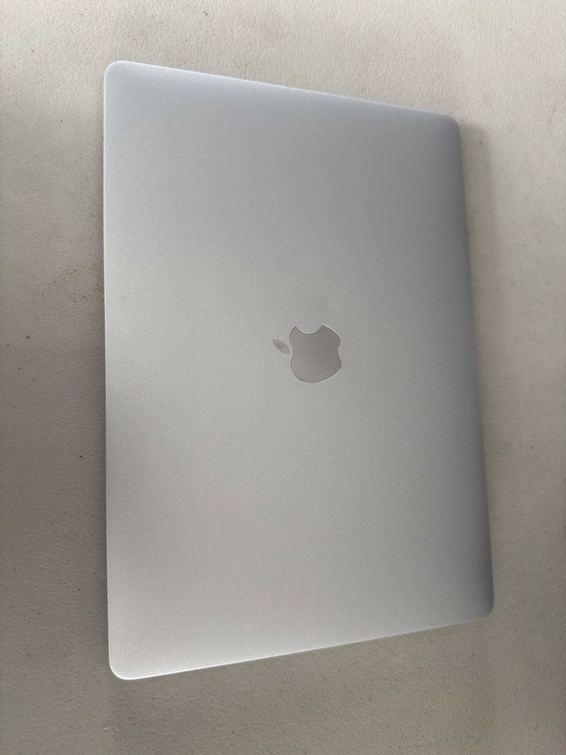 Apple MacBook Pro 2017 with Touch Bar (Category: Laptops & Notebooks) located in Quezon City. Submitted by aubjcs (Listing ID 1468752791, Image 3). Description: 8+256GB No box With Charger - Model: Silver MacBook Pro with iconic Apple logo on aluminum lid - Condition: Clean body overall with minimal wear - Display: Bright and clear screen with login screen ready for setup - Usability: Fully functional standard keyboard layout and large trackpad -