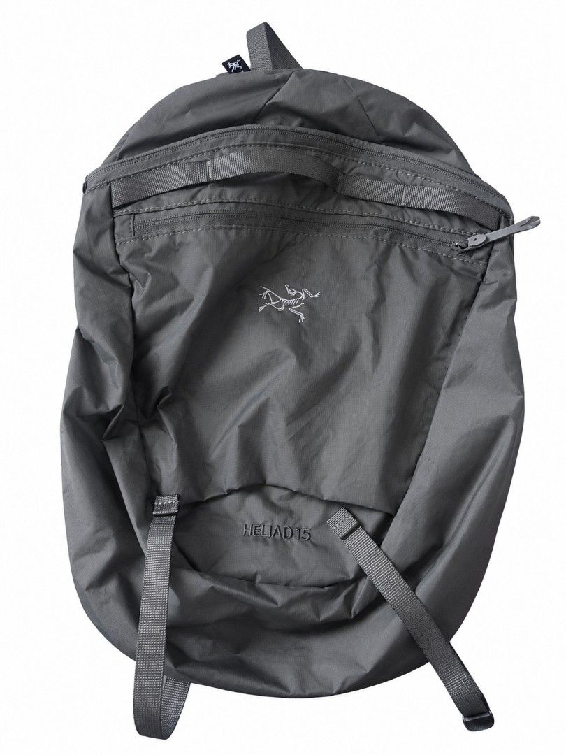 Arc'teryx Heliad 15 Backpack (Category: Backpacks) located in Sorsogon. Submitted by sergioslyughsome (Listing ID 1468726974, Image 1). Description: - Brand/Model: Arc'teryx Heliad 15 Backpack - Color: Sleek Grey - Design: Lightweight, minimalist daypack ideal for everyday commute or light trails - Features: Top grab handle, secure front zippered pocket with durable YKK hardware - Straps: Adjustable shoulder straps with black webbing - Condition: