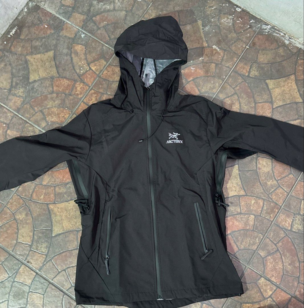 Arc'teryx Waterproof Hooded Jacket (Category: Coats, Jackets and Outerwear) located in Imus. Submitted by mikeythrifts (Listing ID 1468843080, Image 1). Description: - Brand: Arc'teryx Waterproof Jacket - Color: Solid Black - Size: Men's 2XL/3XL - Features: Full zip front, adjustable hood with drawcords, pit zips for ventilation, and zipped side pockets - Condition: Lightweight rain shell, perfect for wet weather - Location: Cavite/Makati.