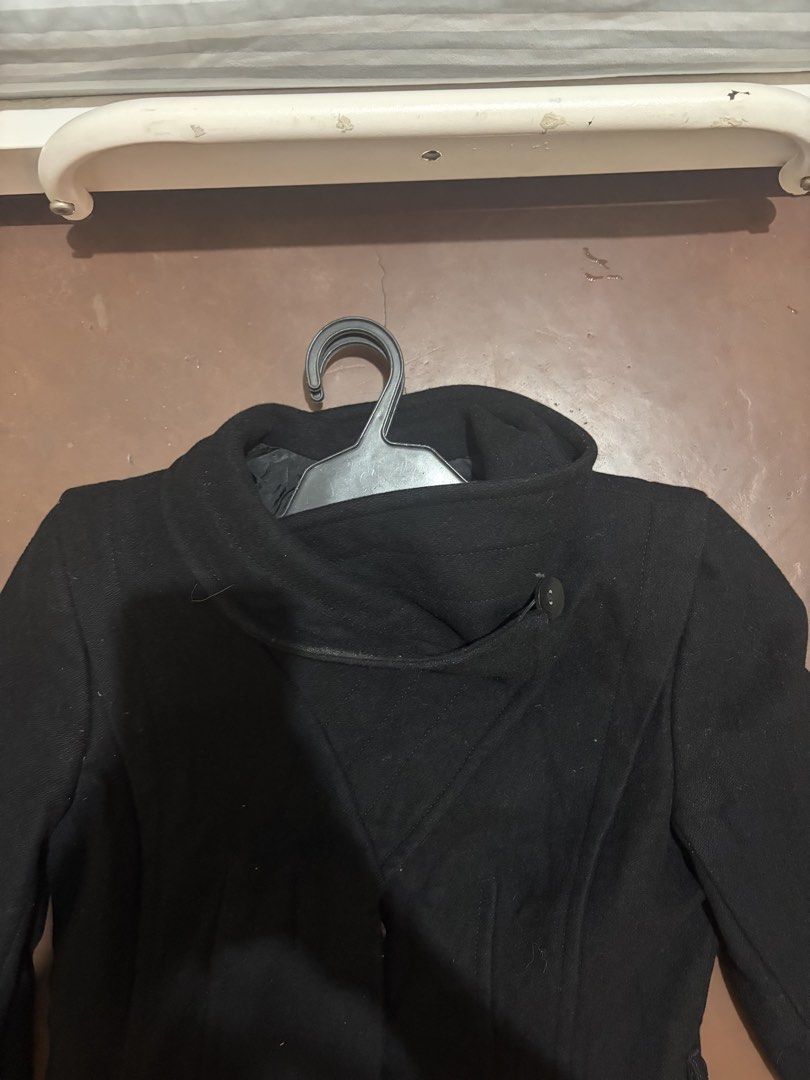 Aritzia Black Trench Coat (Category: Coats, Jackets and Outerwear) located in Manila. Submitted by 9804_ph (Listing ID 1468843773, Image 2). Description: Aritzia Black Trench Coat - Babaton Brand, size XXS on tag - Wool and Cashmere Blend - Unused but washed, air vent and sleeve tag has not been cut - Funnel neck design, fits well on the waist - With belt loops and belt included Measurements: - Shoulder to shoulder: 37cm - Shoulder to top: 66cm -