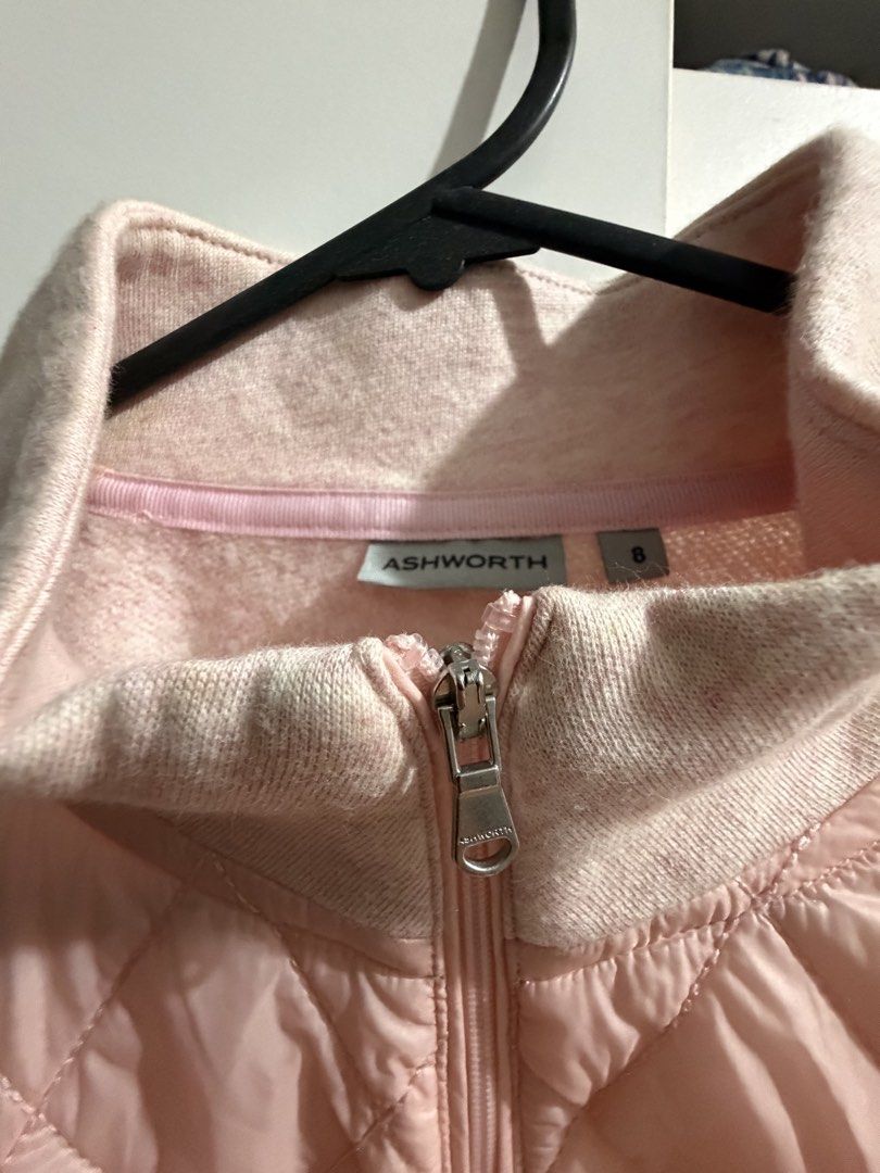 Ashworth Pink Quilted Jacket Size 8 (Category: Coats, Jackets and Outerwear) located in Muntinlupa City. Submitted by choli89790 (Listing ID 1468781450, Image 2). Description: - Brand: Ashworth - Color: Light pink - Style: Full zip jacket with high collar - Design: Quilted front panel with soft knit sleeves - Features: Two front convenient pockets - Size: 8 (tag attached at inner collar).