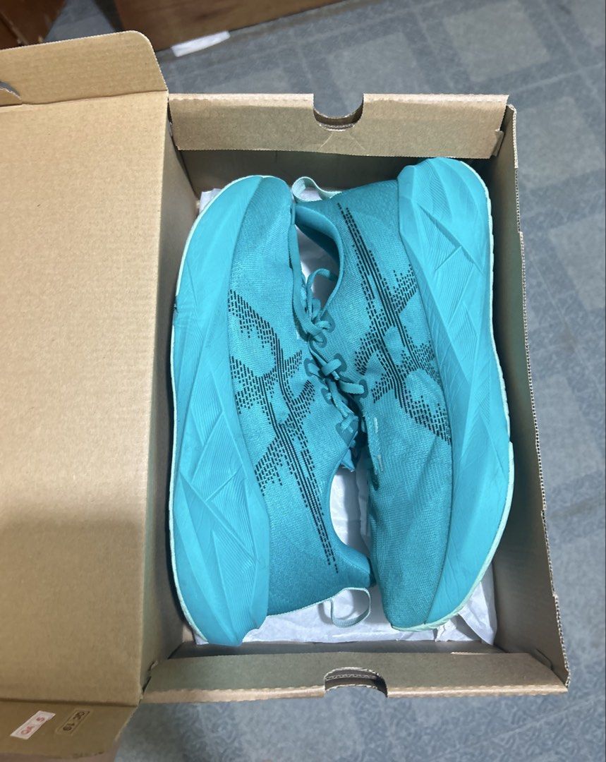 Asics Novablast 5 Wave Teal/Black (Category: Sneakers) located in Imus. Submitted by mikeythrifts (Listing ID 1468842417, Image 1). Description: - Brand: Asics Novablast 5 - Colorway: Wave Teal / Black - Style Code: 1011B974-401 - Size: Men's US 11.5 / EUR 46 / UK 10.5 / CM 29.0 - Condition: Lightly used - Inclusion: Original box and packaging included - Features: Maximum cushioning, lightweight build, and energetic bounce - Best for: Daily train