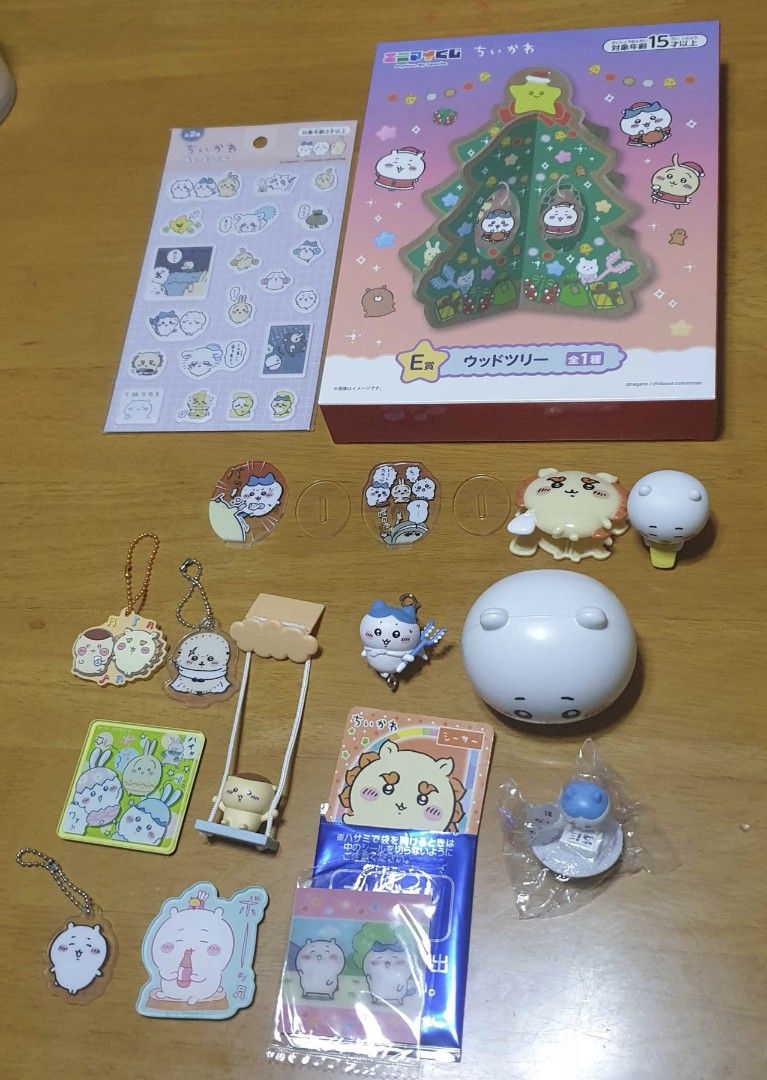 Assorted Chiikawa Merch (Category: Designer & Blind Box Toys) located in Mabalacat. Submitted by xeedoxee (Listing ID 1468929414, Image 1). Description: Chiikawa Merchandise Sale - Assorted items: Wooden Christmas tree display set (with box), puffy sticker sheet, acrylic stands, keychain charms, and miniature figurines - Individual item prices: ₱40 to ₱300 - Perfect for collectors wanting a mix of characters and merch types - Available for indivi