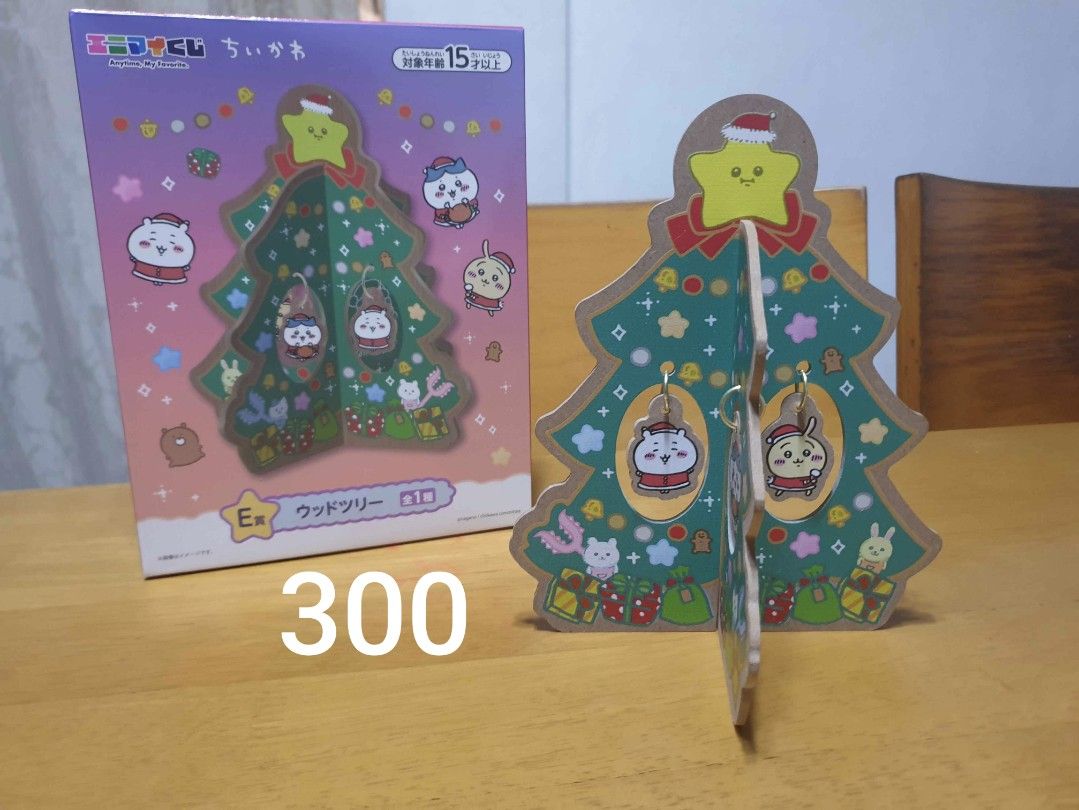 Assorted Chiikawa Merch (Category: Designer & Blind Box Toys) located in Mabalacat. Submitted by xeedoxee (Listing ID 1468929414, Image 3). Description: Chiikawa Merchandise Sale - Assorted items: Wooden Christmas tree display set (with box), puffy sticker sheet, acrylic stands, keychain charms, and miniature figurines - Individual item prices: ₱40 to ₱300 - Perfect for collectors wanting a mix of characters and merch types - Available for indivi