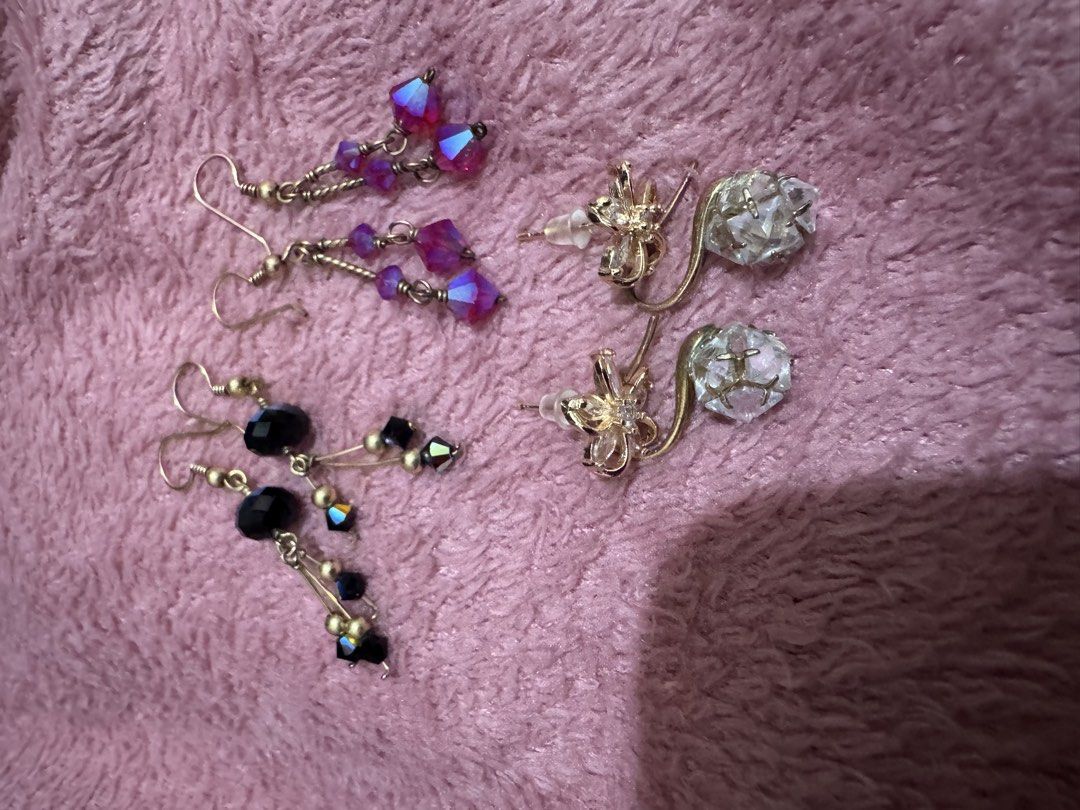 Assorted dangle and stud fashion earrings bundle set (Category: Earrings) located in Angeles City. Submitted by thala.1204.68 (Listing ID 1468765505, Image 2). Description: - Set of 4 versatile fashion earrings - Includes: black beaded dangles, magenta crystal dangles, gold flower studs, and clear chunk crystal hooks - All feature gold-tone metal hardware - Great for daily wear or special occasions - Selling as a full set only (no individual sale