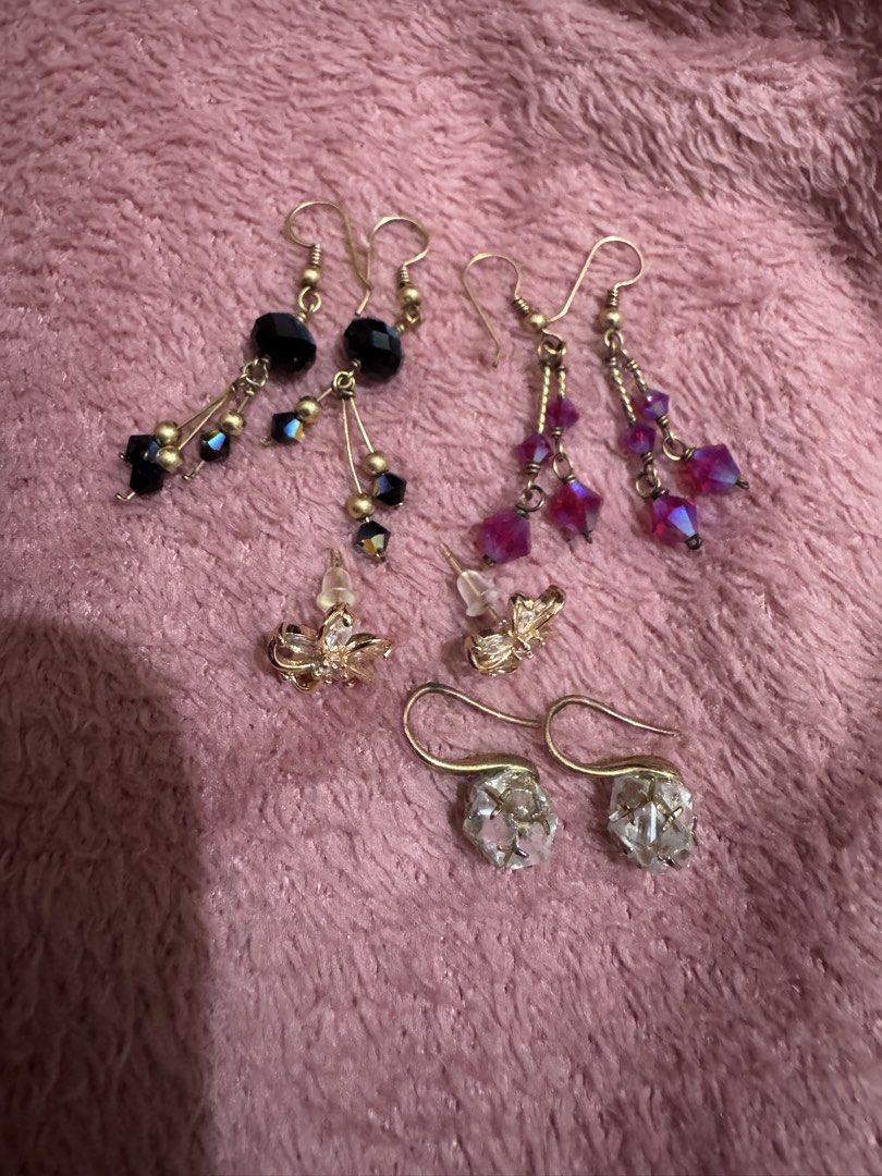 Assorted dangle and stud fashion earrings bundle set (Category: Earrings) located in Angeles City. Submitted by thala.1204.68 (Listing ID 1468765505, Image 1). Description: - Set of 4 versatile fashion earrings - Includes: black beaded dangles, magenta crystal dangles, gold flower studs, and clear chunk crystal hooks - All feature gold-tone metal hardware - Great for daily wear or special occasions - Selling as a full set only (no individual sale