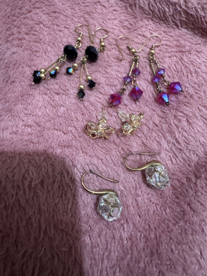 Assorted dangle and stud fashion earrings bundle set (Category: Earrings) located in Angeles City. Submitted by thala.1204.68 (Listing ID 1468765505, Image 3). Description: - Set of 4 versatile fashion earrings - Includes: black beaded dangles, magenta crystal dangles, gold flower studs, and clear chunk crystal hooks - All feature gold-tone metal hardware - Great for daily wear or special occasions - Selling as a full set only (no individual sale