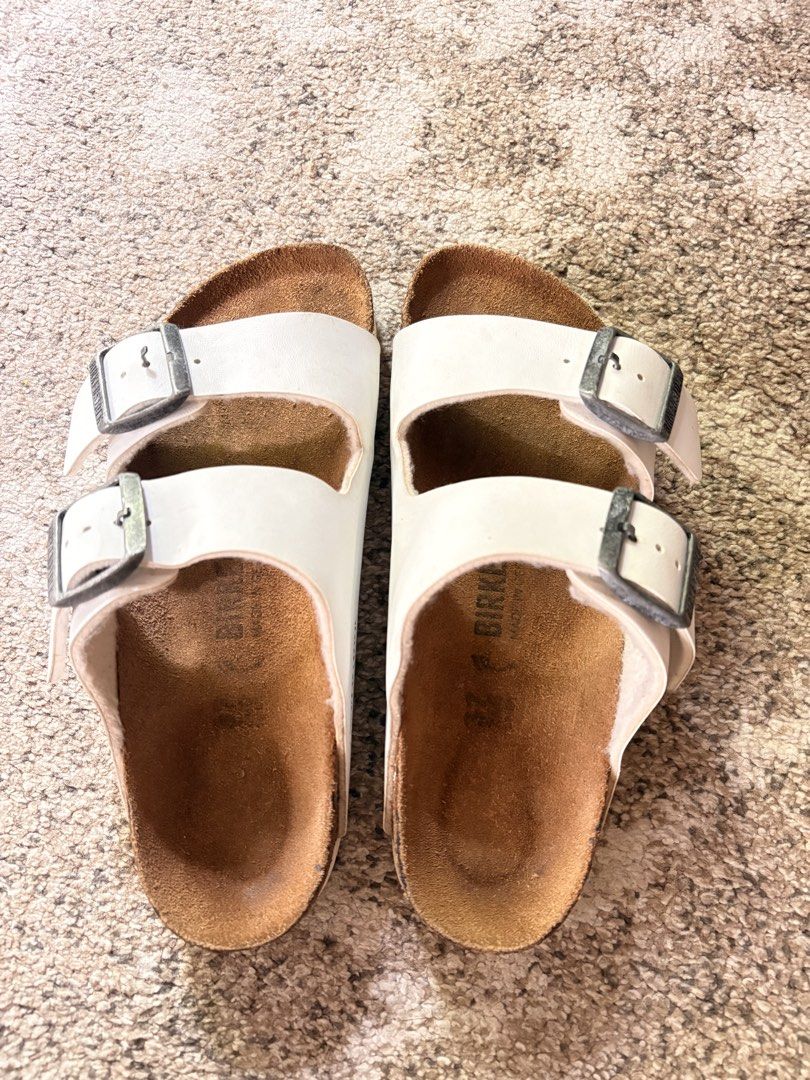 Auth Preloved Birkenstock Arizona (Category: Slippers and slides) located in Paranaque City. Submitted by silentstone.dolphin (Listing ID 1468768797, Image 2). Description: Color White.. Brass Buckle.. Visible Print.. Size 37N.. Clean&Ready to Wear..✅ Best Seller Colorway!🥳 Super Nice in Actual😍.
