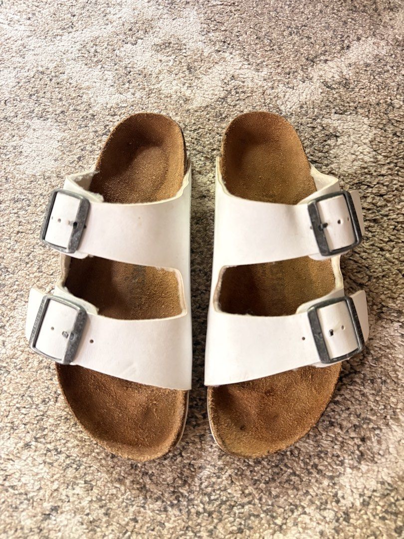 Auth Preloved Birkenstock Arizona (Category: Slippers and slides) located in Paranaque City. Submitted by silentstone.dolphin (Listing ID 1468768797, Image 1). Description: Color White.. Brass Buckle.. Visible Print.. Size 37N.. Clean&Ready to Wear..✅ Best Seller Colorway!🥳 Super Nice in Actual😍.