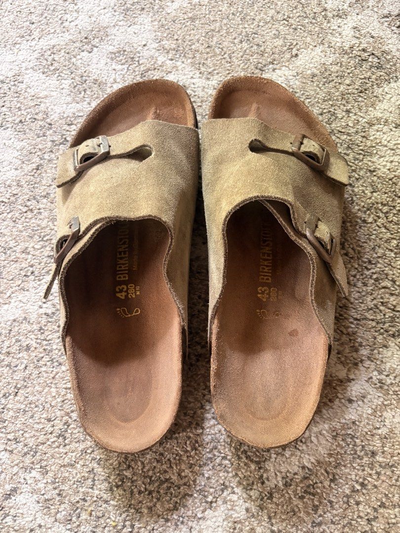 Auth Preloved Zurich Birkenstock (Category: Slippers & Slides) located in Paranaque City. Submitted by silentstone.dolphin (Listing ID 1468926047, Image 2). Description: Suede Leather.. Taupe Color.. Visible Print.. Brass Buckle.. Clean&Ready to Wear✅ Super Nice in Actual😍.