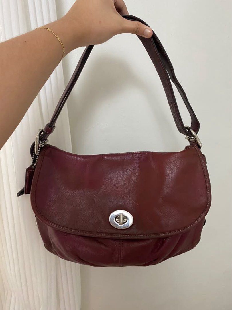 AUTHENTIC Coach Burgundy Leather Shoulder Bag with Turnlock Closure (Category: Luxury Bags & Wallets) located in Mexico. Submitted by alexacarts (Listing ID 1468851887, Image 1). Description: - no more photos *please manage your expectations as these are preloved* *no return / exchange* LOC: Pampanga Payment: Gcash / Any mode of bank transfer Courier: J&T.