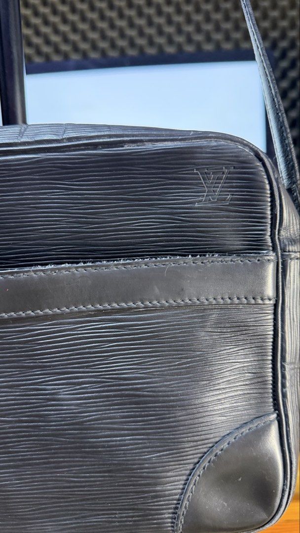 Authentic Louis Vuitton Epi Leather Black Shoulder Bag (Category: Luxury Bags & Wallets) located in Caloocan City. Submitted by prof_music1979 (Listing ID 1468794797, Image 3). Description: - Authentic Louis Vuitton shoulder bag in black Epi leather - Features iconic embossed LV monogram and gold-tone hardware - Convenient exterior front slip pocket and secure top zip closure - Adjustable leather strap with sturdy brass hardware - Dark fabric-lin
