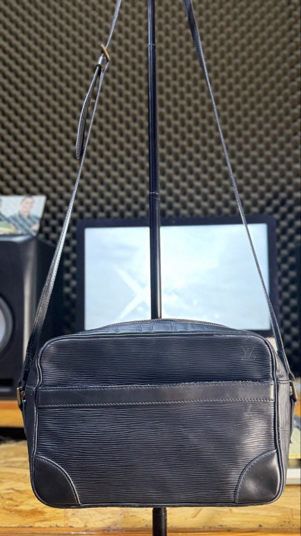 Authentic Louis Vuitton Epi Leather Black Shoulder Bag (Category: Luxury Bags & Wallets) located in Caloocan City. Submitted by prof_music1979 (Listing ID 1468794797, Image 2). Description: - Authentic Louis Vuitton shoulder bag in black Epi leather - Features iconic embossed LV monogram and gold-tone hardware - Convenient exterior front slip pocket and secure top zip closure - Adjustable leather strap with sturdy brass hardware - Dark fabric-lin