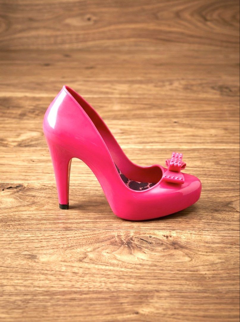 Authentic Melissa (Category: Heels) located in Baliuag. Submitted by sirc_28 (Listing ID 1468803147, Image 2). Description: Mel by Melissa “Rasberry II” pink jelly pumps. This playful style features a signature bubblegum-scented Melflex plastic construction, a textured pyramid-studded bow detail on the toe box, and a distinctive leopard print cushioned insole. .