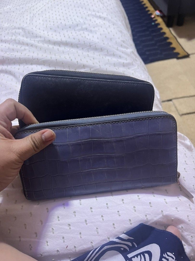 Authentic Michael Kors and Tory Burch Zip Wallets (Category: Wallets & Card holders) located in Manila. Submitted by asissaleh35322 (Listing ID 1468899265, Image 2). Description: - 2-in-1 designer wallet bundle for everyday use - 1st Wallet: Blue Michael Kors embossed leather with silver hardware - 2nd Wallet: Black Tory Burch textured leather with gold hardware and centered logo - Both feature secure zip-around closure - Interior includes multip