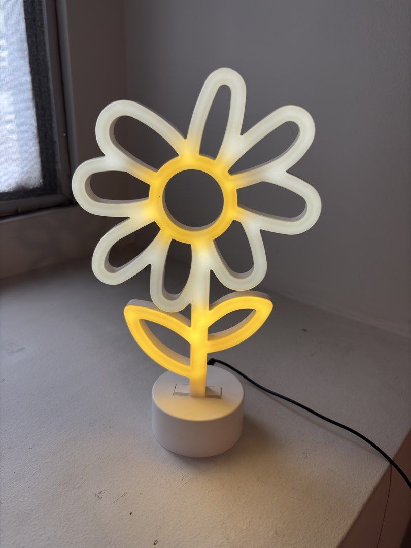 Authentic Typo Sunflower-Shaped Bedside Lamp (Category: Other Home Decor) located in Mandaluyong City. Submitted by material_boi (Listing ID 1468770688, Image 1). Description: Store bought for I think ₱1,500. Rarely used. Maganda to kasi di siya masakit sa mata. Very cute! You may attach it sa usb or sa adapter. Wala siyang included na adapter, provide na lang kayo. No issues, alikabok konti. RFS: decluttering .